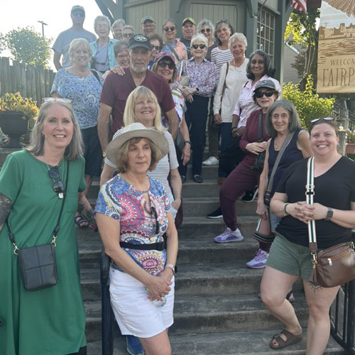 Upstate Directors and Participants standing on stairs